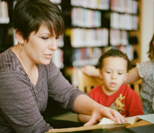 교육의 목적은 선과 악 지도, 반복적인 훈련해야 가능 Mother reading to children inside of a library. Books in the background holding a book, kids looking and listening intently. https://www.instagram.com/AwCreativeUT/https://www.awedcreative.com/https://www.awcreativeut.com#AwCreativeUT #awcreative #AdamWinger Adam Robert Winger