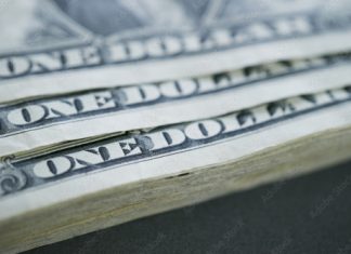 20년 이상 대출 갚은 80만 명 학자금 탕감…교육부 발표 Pile of one dollar bills