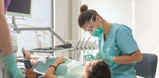 “예비 치대생 기다립니다” Orthodontist treating her patient in dental office