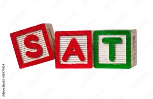 Wooden blocks forming the letters SAT isolated on white