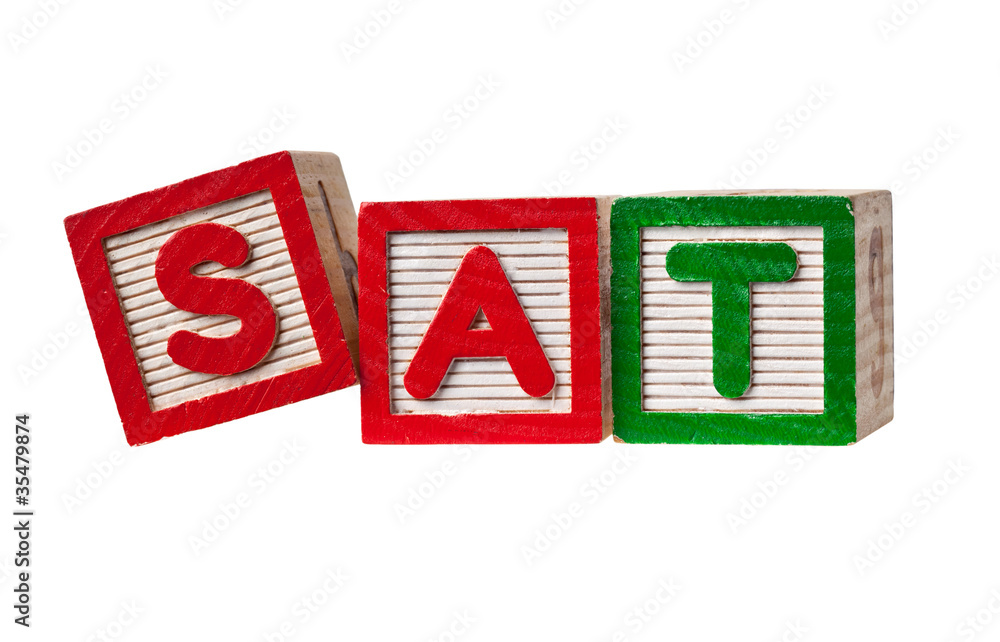 Wooden blocks forming the letters SAT isolated on white